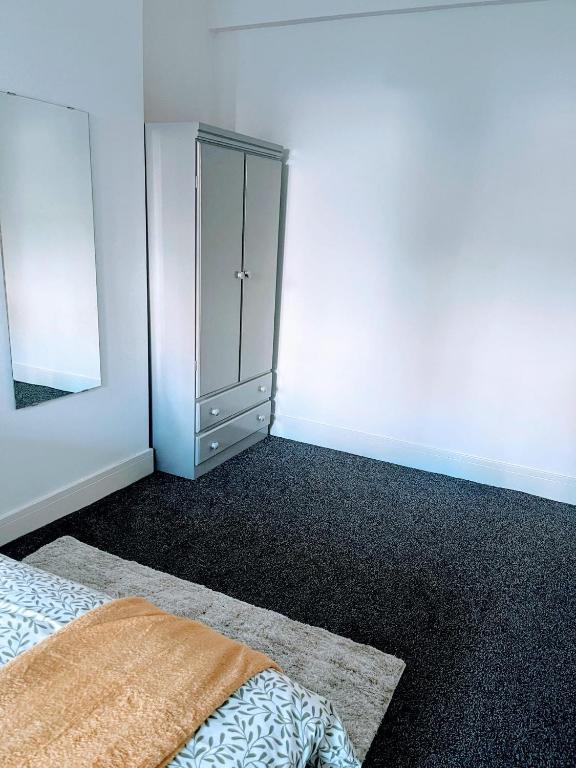 Postel nebo postele na pokoji v ubytování Bay Wind Apartment