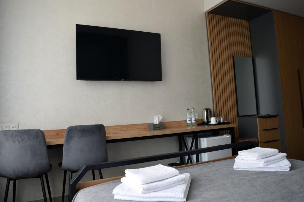 TV a/nebo společenská místnost v ubytování Prime Hotel