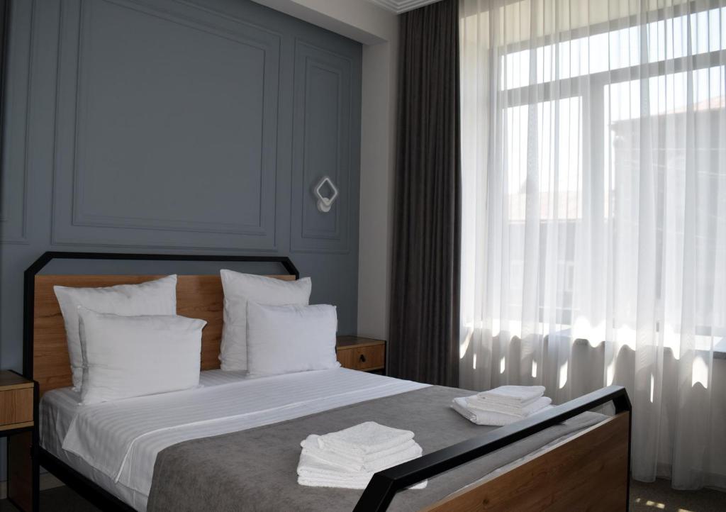 Postel nebo postele na pokoji v ubytování Prime Hotel