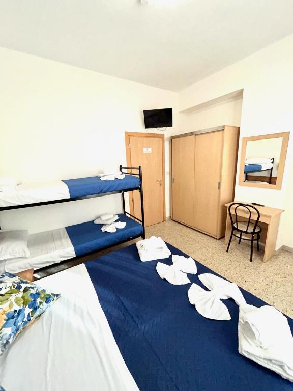 Postel nebo postele na pokoji v ubytování Hotel Staccoli