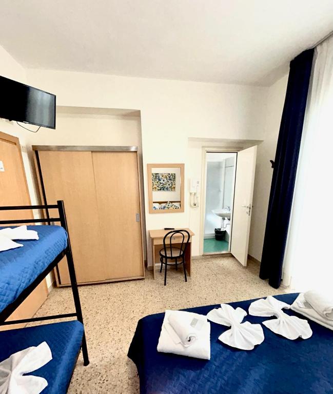 Postel nebo postele na pokoji v ubytování Hotel Staccoli