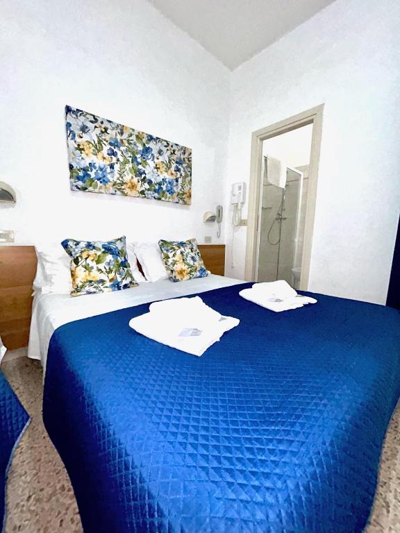 Postel nebo postele na pokoji v ubytování Hotel Staccoli
