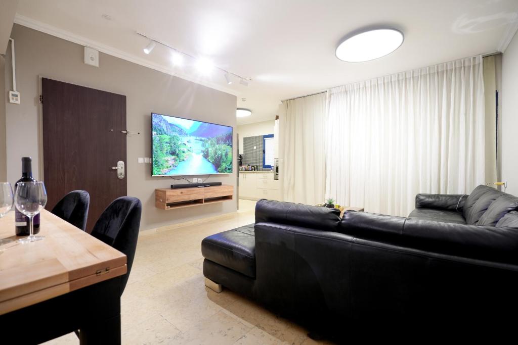 TV a/nebo společenská místnost v ubytování Central Park Residence