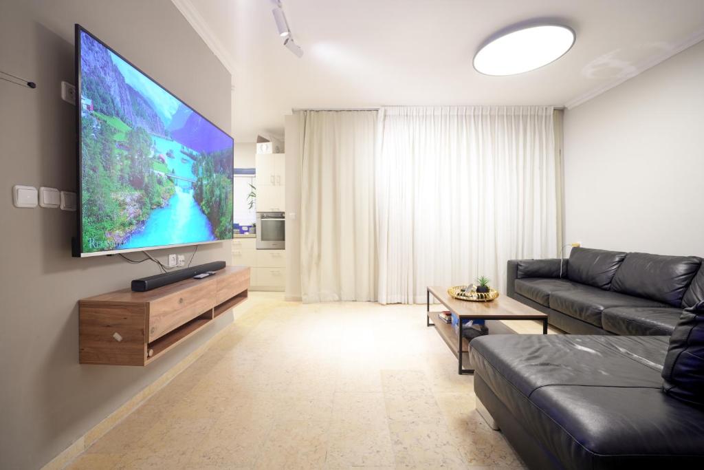 TV a/nebo společenská místnost v ubytování Central Park Residence