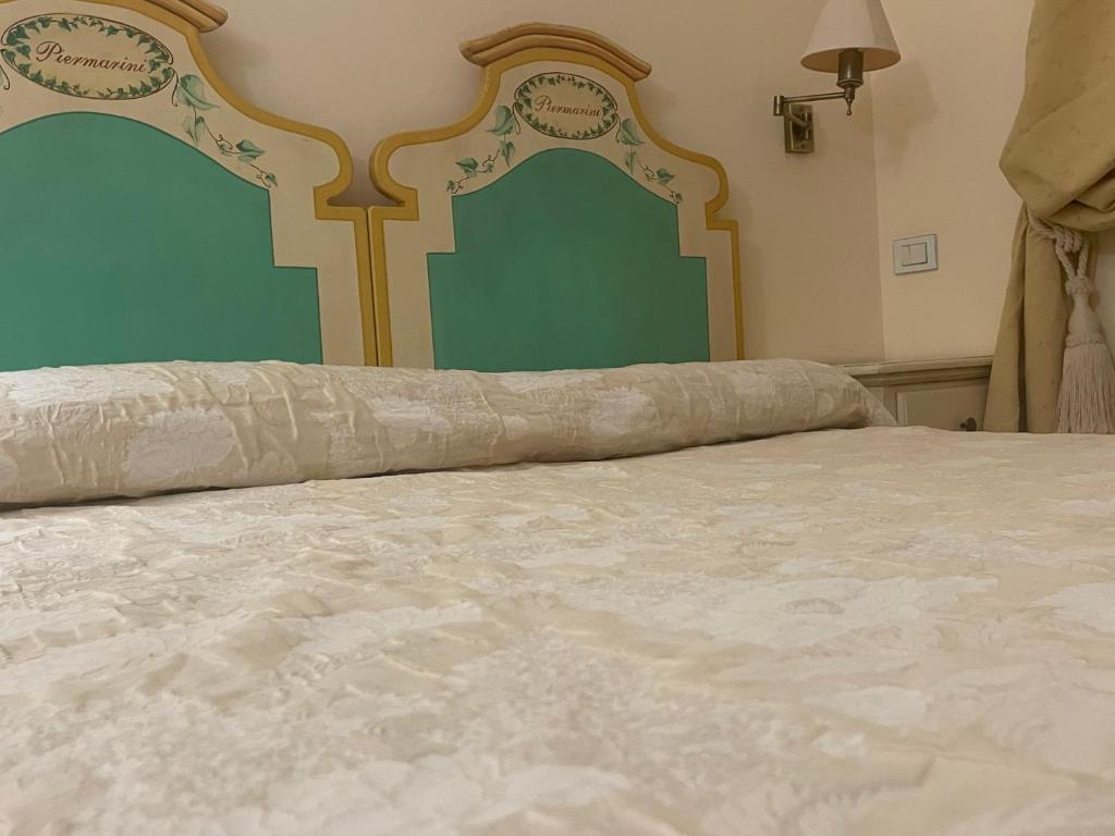 Postel nebo postele na pokoji v ubytování Casa Piermarini