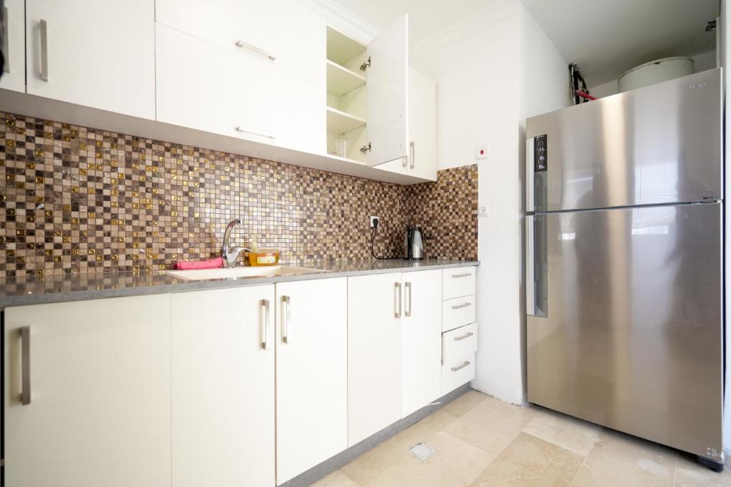 Kuchyň nebo kuchyňský kout v ubytování Central Park Residence
