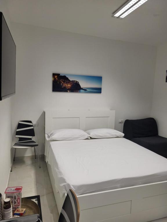 Postel nebo postele na pokoji v ubytování SG Rooms