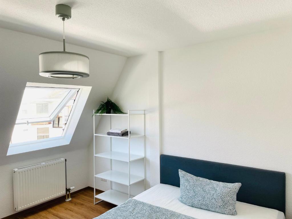 Postel nebo postele na pokoji v ubytování ROOFTOP RESlDENCE