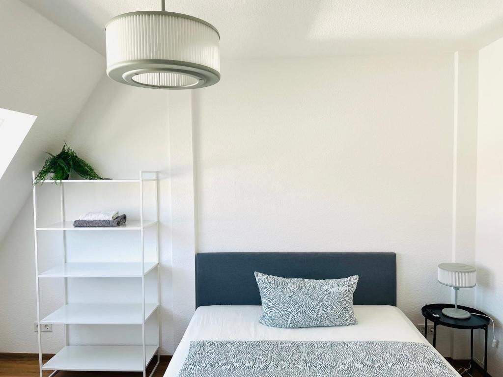 Postel nebo postele na pokoji v ubytování ROOFTOP RESlDENCE