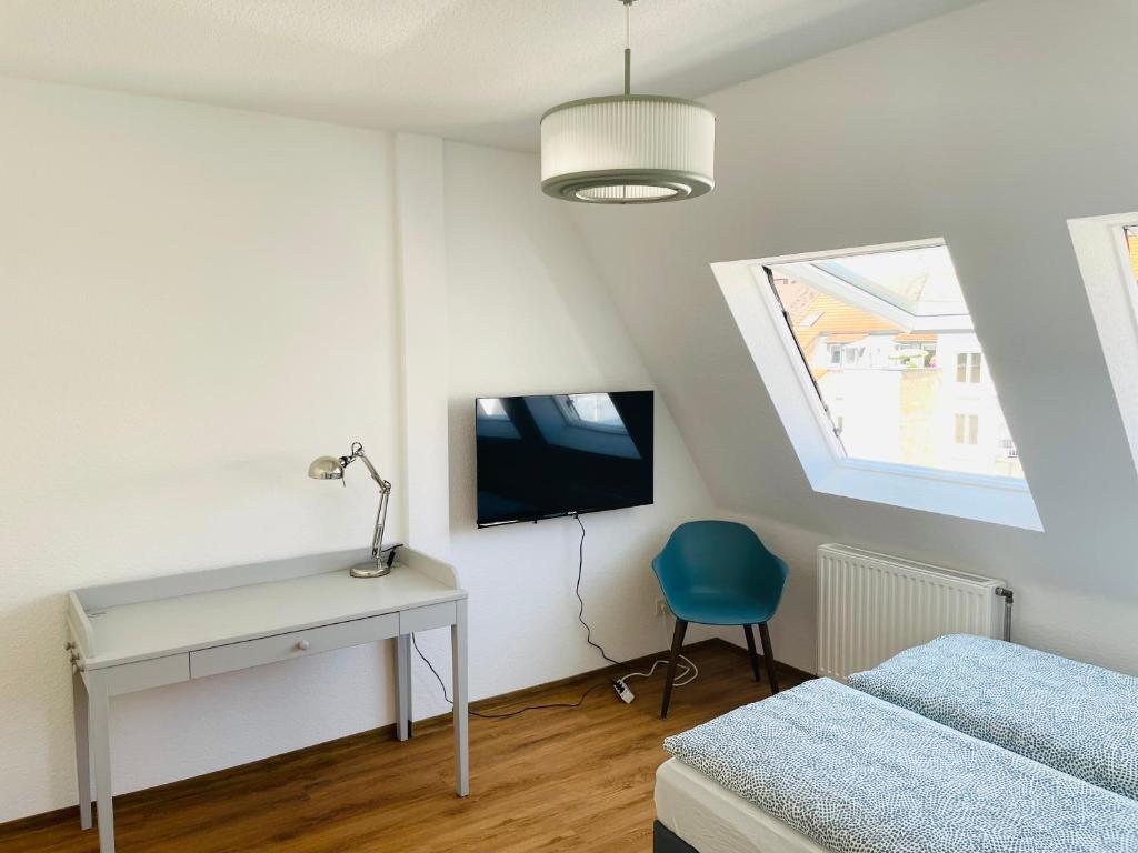 Postel nebo postele na pokoji v ubytování ROOFTOP RESlDENCE