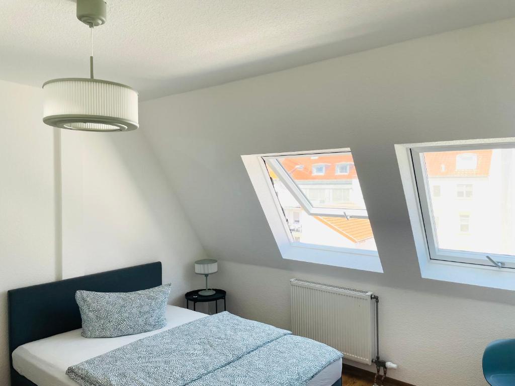 Postel nebo postele na pokoji v ubytování ROOFTOP RESlDENCE