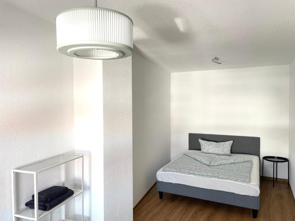Postel nebo postele na pokoji v ubytování ROOFTOP RESlDENCE