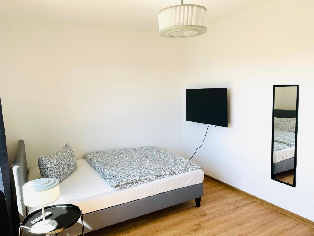 Postel nebo postele na pokoji v ubytování ROOFTOP RESlDENCE