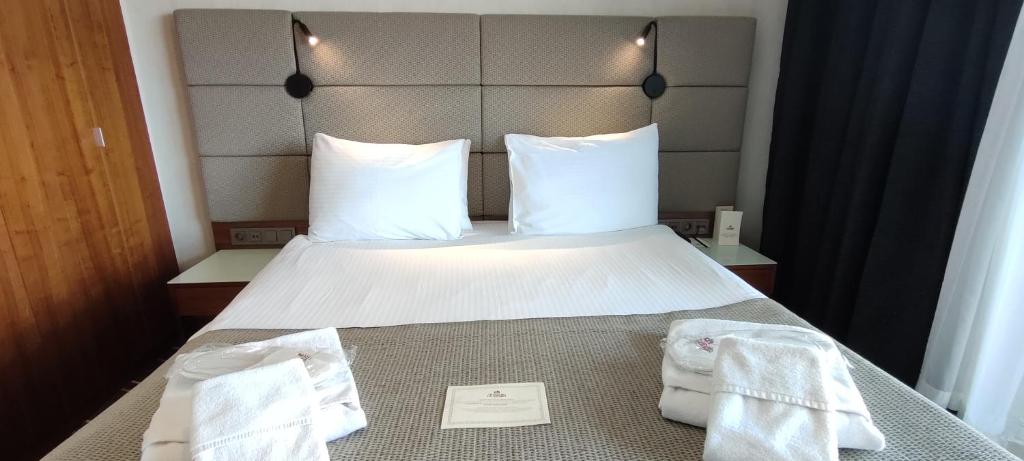 a hotel room with a bed with towels on it at Cihangir Hotel Bosphorus in Istanbul