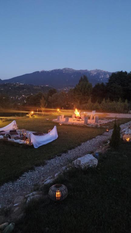 a group of tents in a field at night at Rooftop View in Predeluţ