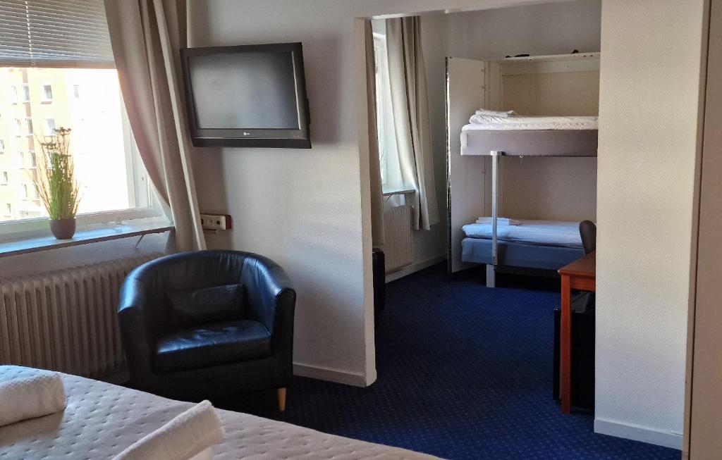Postel nebo postele na pokoji v ubytování Hotell Drott