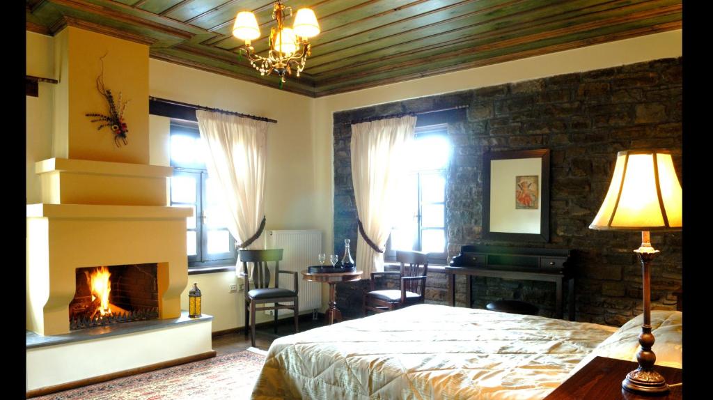 A bed or beds in a room at Adrasteia Guesthouse