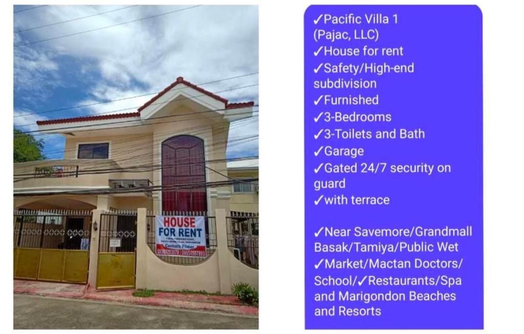 un cartel delante de un edificio con nombres en Pacific Villa Home, en Lapu Lapu City