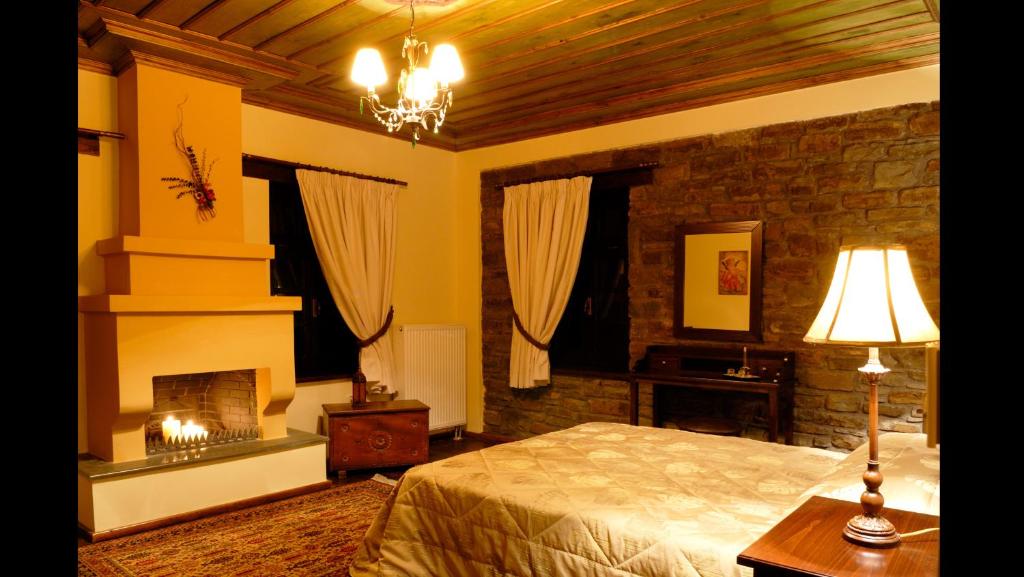 A bed or beds in a room at Adrasteia Guesthouse