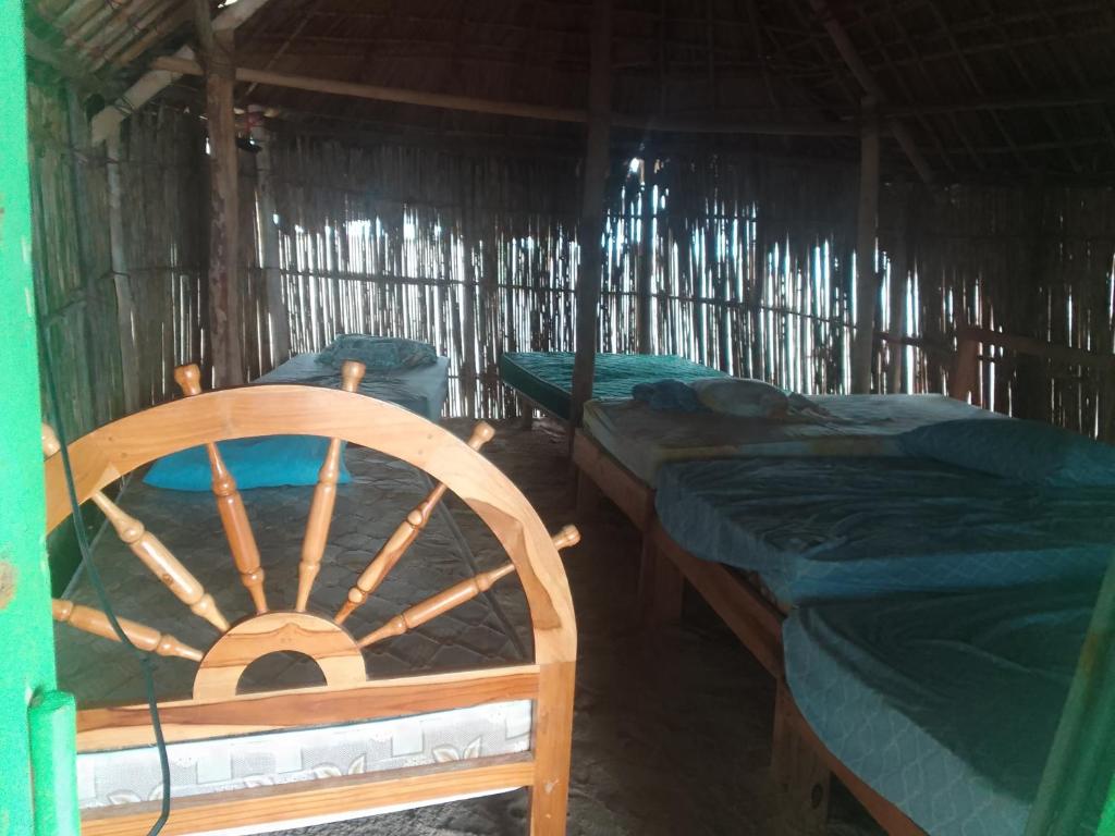 A bed or beds in a room at San Blas Tours Aridub