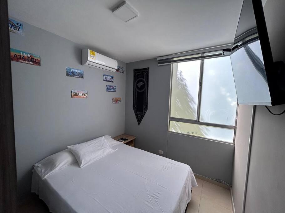 Postelja oz. postelje v sobi nastanitve Apartamento en Valledupar