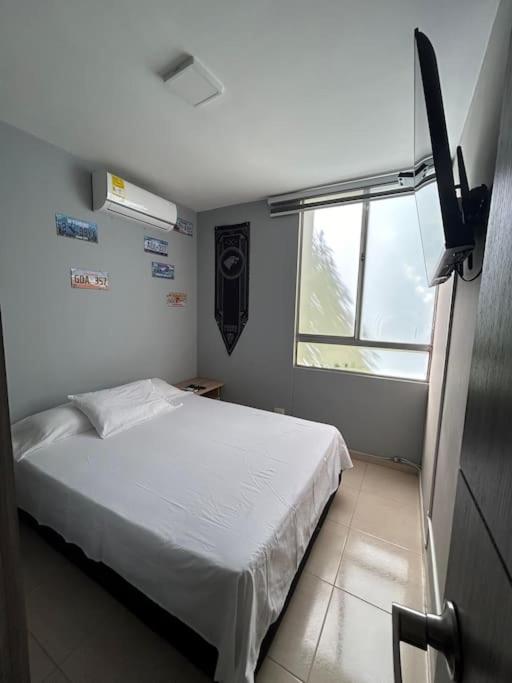 Postelja oz. postelje v sobi nastanitve Apartamento en Valledupar