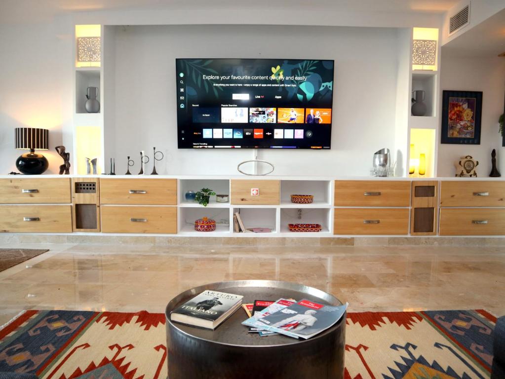 a living room with a flat screen tv on a wall at Marina16 - La Hacienda - Alcaidesa in San Roque