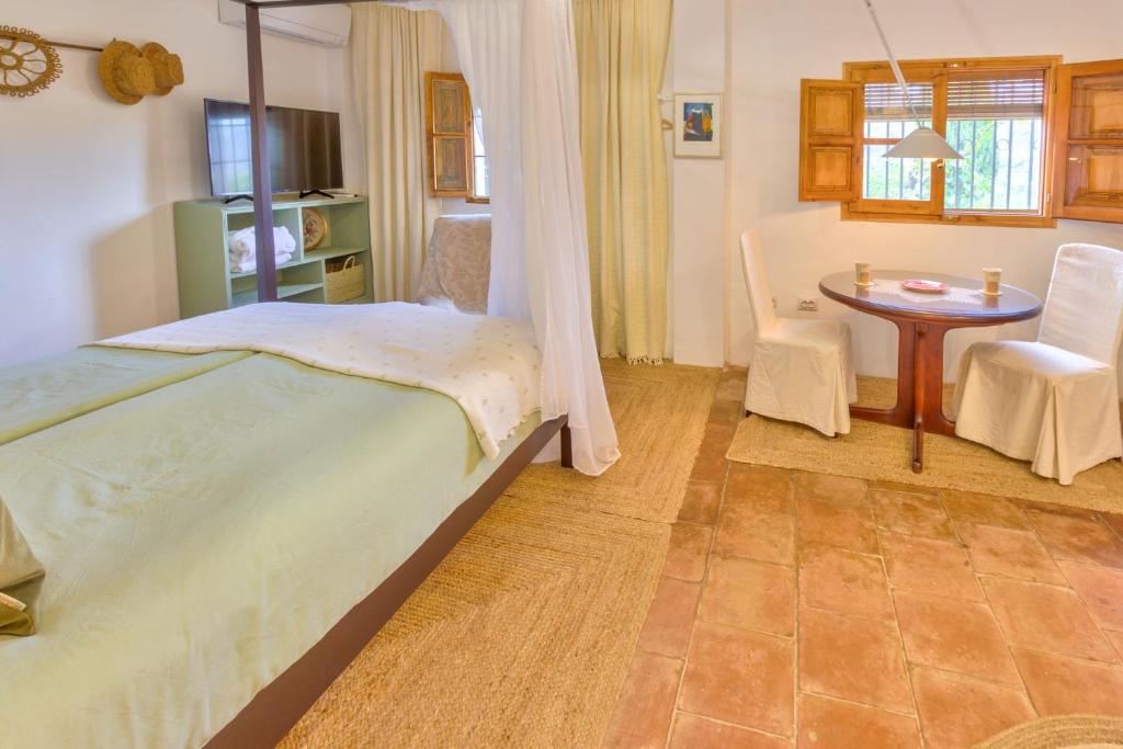 Posteľ alebo postele v izbe v ubytovaní Cortijo El Pino Retreat