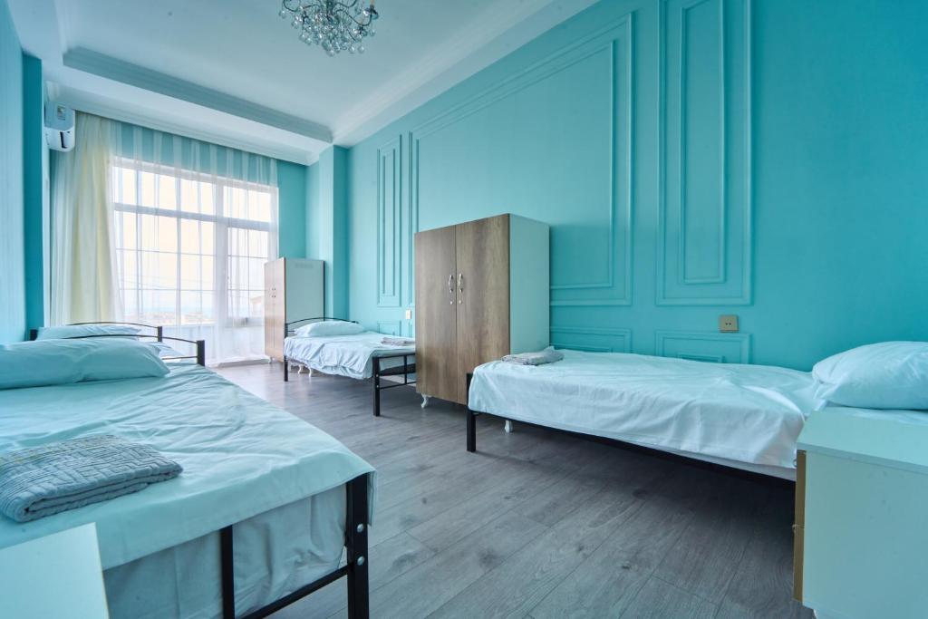 Postel nebo postele na pokoji v ubytování Premium Sea View Hotel & Hostel