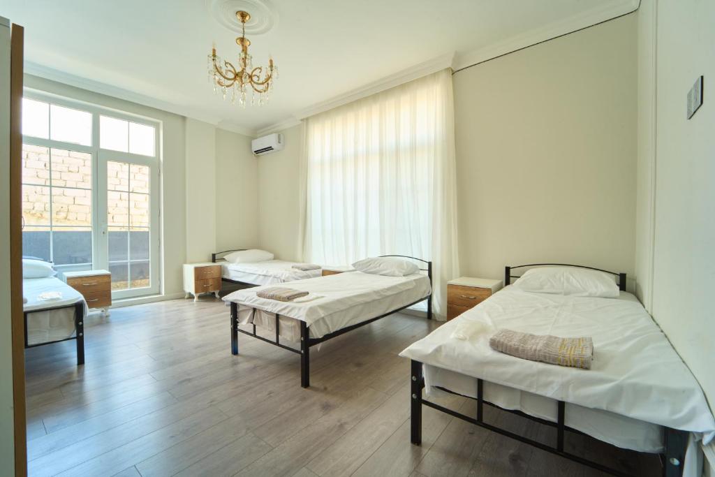 Postel nebo postele na pokoji v ubytování Premium Sea View Hotel & Hostel
