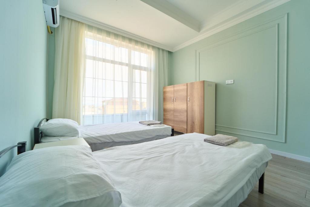 Postel nebo postele na pokoji v ubytování Premium Sea View Hotel & Hostel