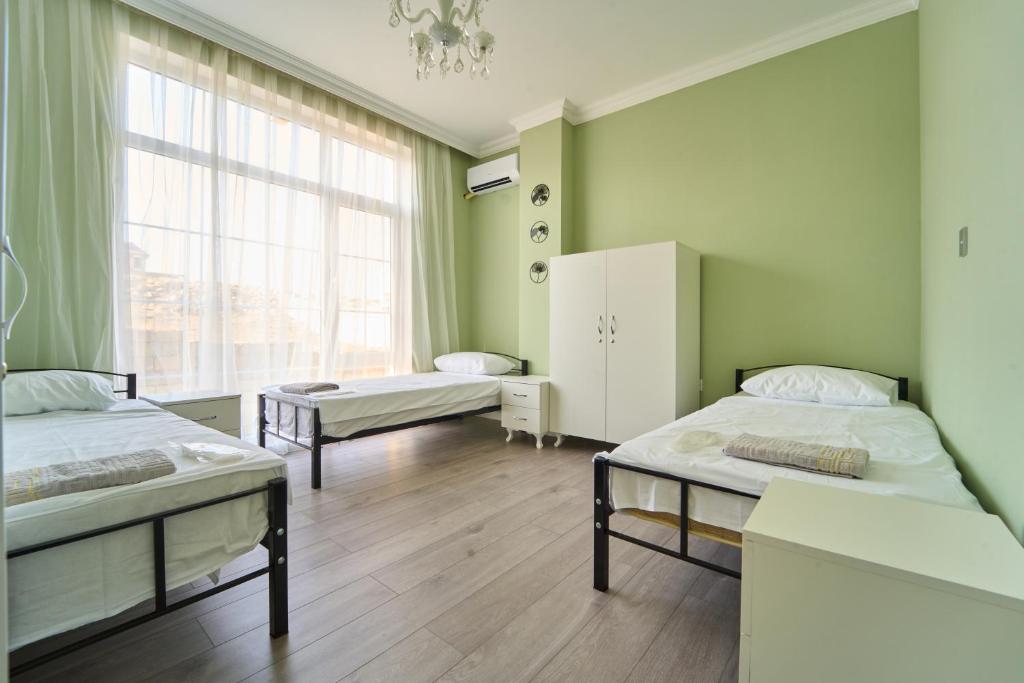Postel nebo postele na pokoji v ubytování Premium Sea View Hotel & Hostel