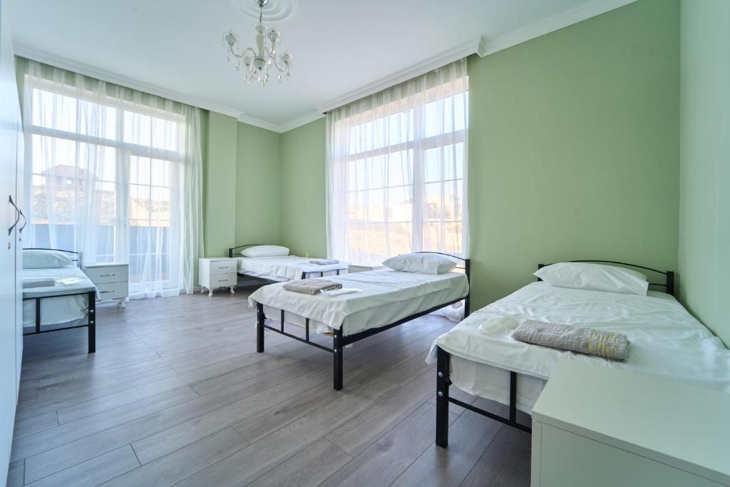 Postel nebo postele na pokoji v ubytování Premium Sea View Hotel & Hostel