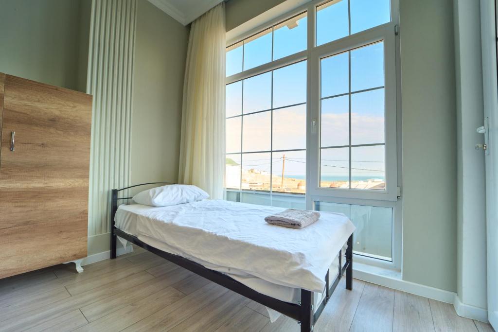 Postel nebo postele na pokoji v ubytování Premium Sea View Hotel & Hostel
