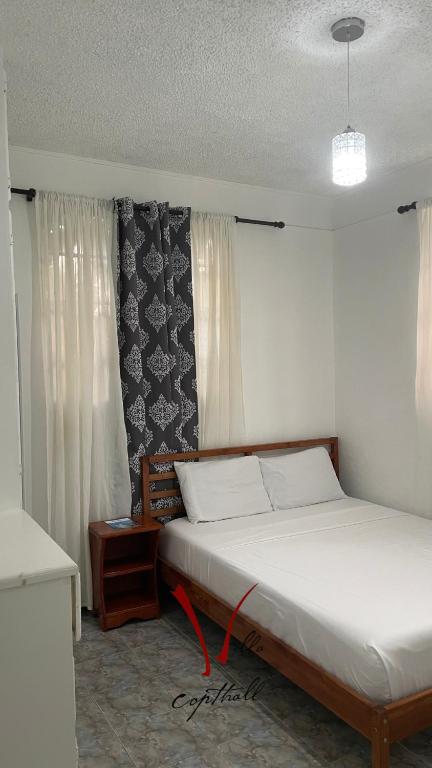 Postel nebo postele na pokoji v ubytování Villa Copthall