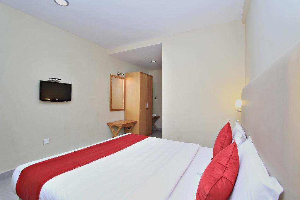 Postel nebo postele na pokoji v ubytování Super Townhouse Hills Palace