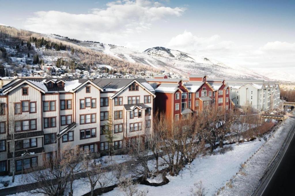 a group of buildings in a city with snow at Marriott Summit Watch 1BD in Park City
