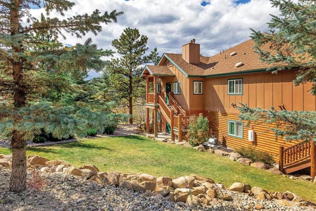 a large wooden house with a yard at Worldmark - Estes Park 2BD in Estes Park