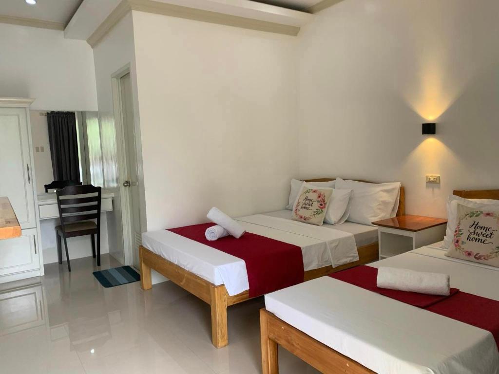 Postel nebo postele na pokoji v ubytování Sunshine Stay Panglao