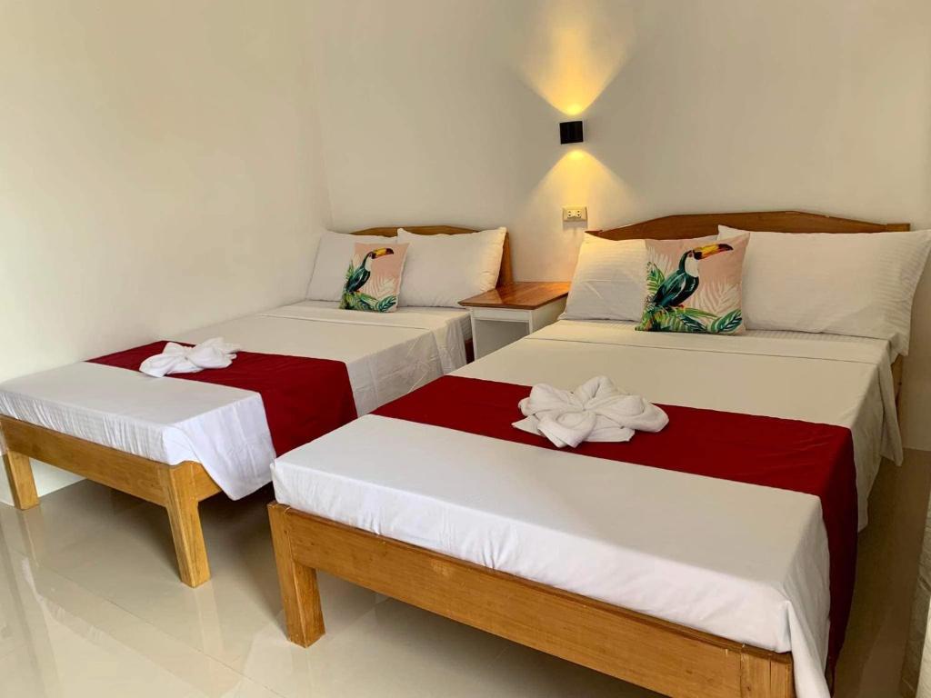 Postel nebo postele na pokoji v ubytování Sunshine Stay Panglao
