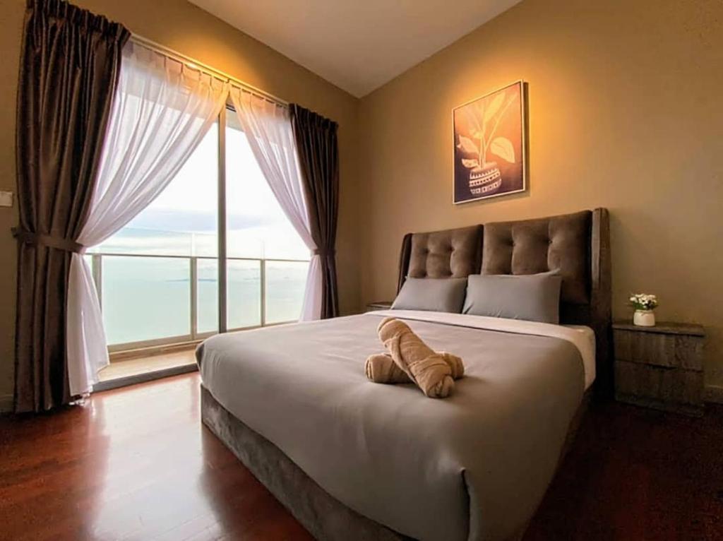 Ένα ή περισσότερα κρεβάτια σε δωμάτιο στο Silverscape Residence 3 Bedrooms Suite by MJ Holiday