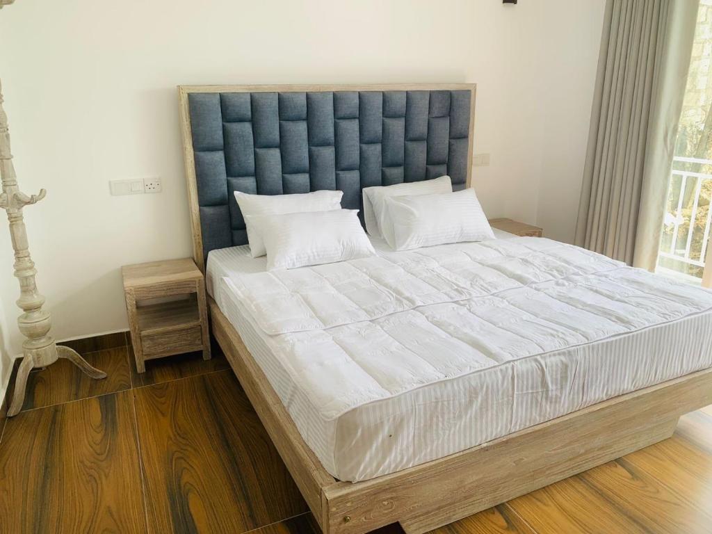 Postel nebo postele na pokoji v ubytování Citrine Kandy