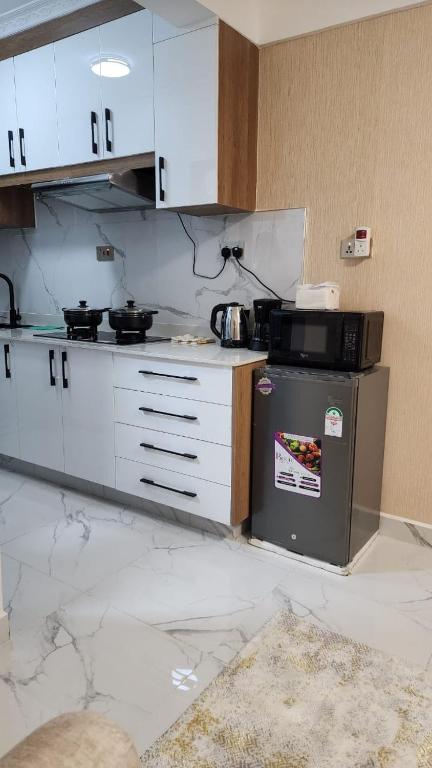 Kuchyň nebo kuchyňský kout v ubytování Cozy Studio in Kilimani near Yaya Center
