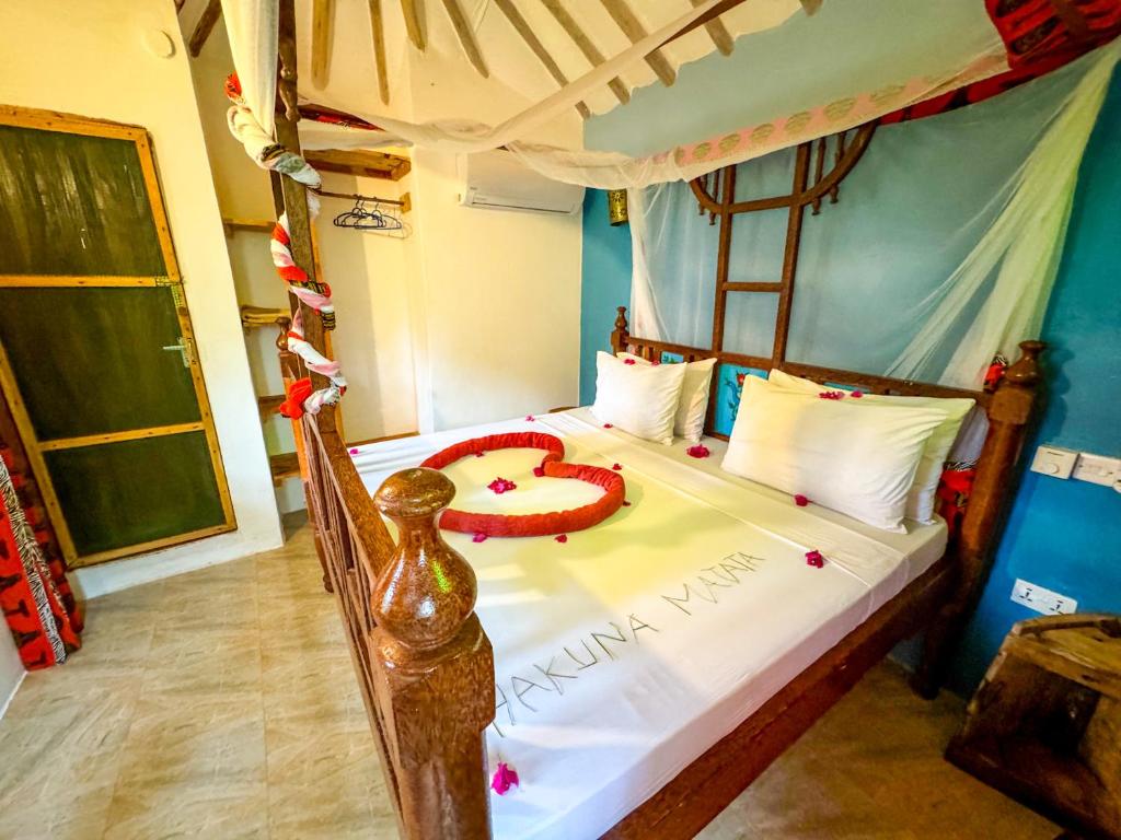 Postel nebo postele na pokoji v ubytování Sagando Bungalows Zanzibar