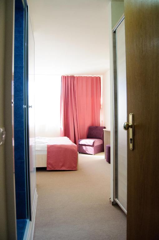Postel nebo postele na pokoji v ubytování Hotel Doina