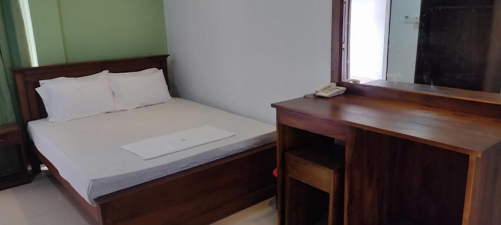 Postel nebo postele na pokoji v ubytování Empire Valley Hotel