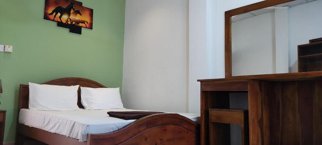 Postel nebo postele na pokoji v ubytování Empire Valley Hotel