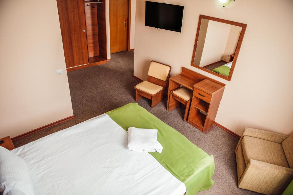 Postel nebo postele na pokoji v ubytování Hotel Doina