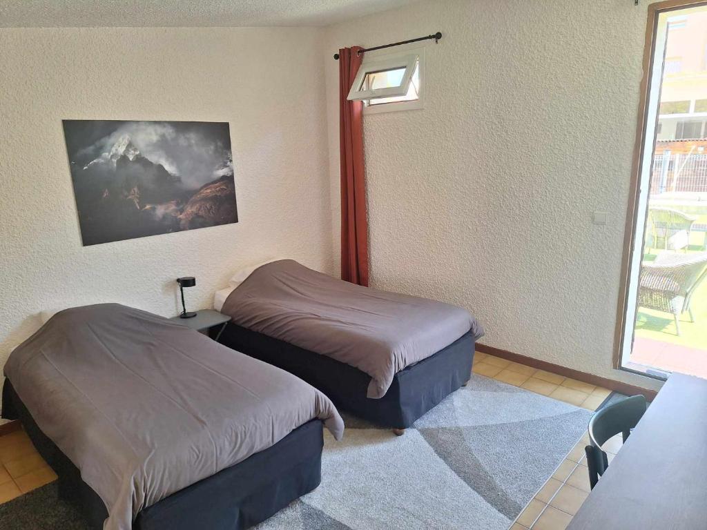Postel nebo postele na pokoji v ubytování Hotel Le Connetable