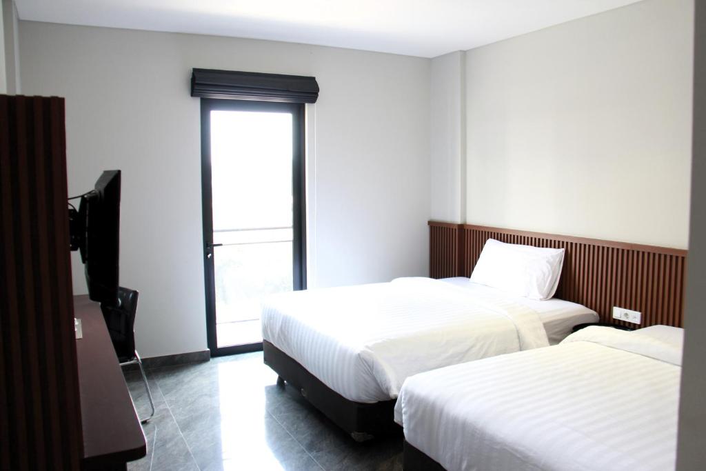 Postel nebo postele na pokoji v ubytování Moscato Hotel